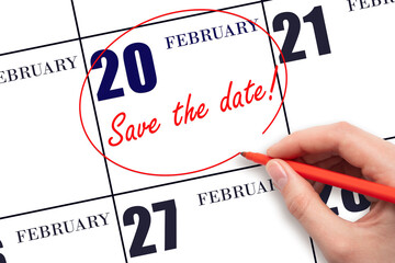 Hand drawing red line and writing the text Save the date on calendar date February 20.