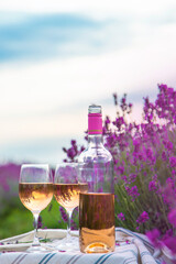 Obraz na płótnie Canvas Wine in a lavender field. Selective focus.