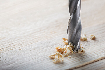 metal drill bit make holes in wooden oaks plank