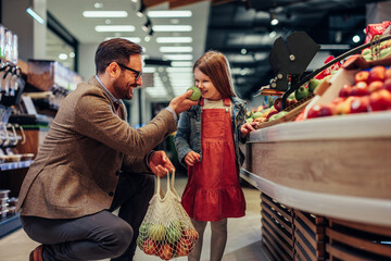 Cute single father and his daughter in shopping