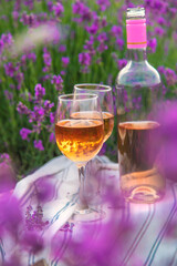 Wine in a lavender field. Selective focus.