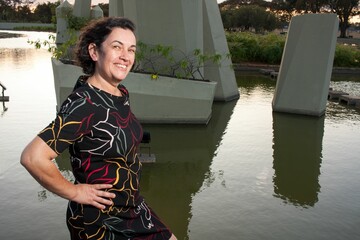 Mature lady at the park on a sunny day enjoying herself