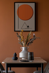 Stylish decorations on table under poster