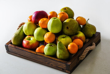 different fruits on a wooden tray