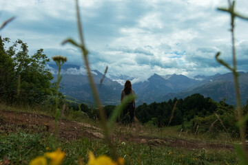 Woman contemplating the Tena Valley in the Spanish Pyrenees.