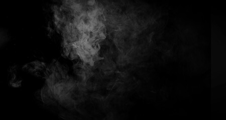 Abstract smoke texture over black. Fog in the darkness background .