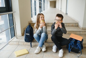 Education is power when selecting food for health. Happy kids take snack break. Nutrition and...