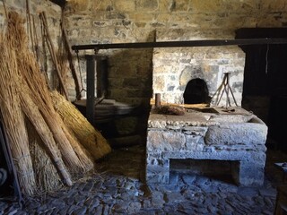 old stone forge with hand operated bellows