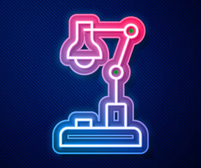 Glowing neon line Table lamp icon isolated on blue background. Vector