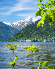 Town and lake of Zell am See in front of the impressive snow-capped Kitzsteinhorn, Zell am See,...