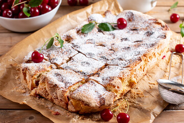 Fresh sponge cake with cherries. Chiffon biscuit. Homemade bakery concept