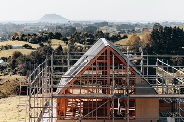Drone view of a house scaffolding in New Zealand