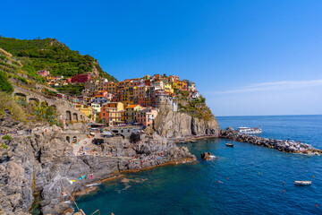 Fototapeta na wymiar Beautiful view of the city on the rock, Manarola, Italy, Liguria, Cinque Terre, Europe