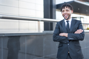 Fototapeta premium african businessman in suit at street