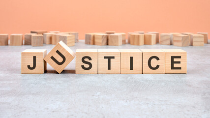 Fototapeta premium JUSTICE word written on wood block - text on wooden table for your desing, concept.