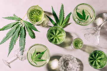 SBD hemp drink in various glasses, light concrete background hard shadow, energy cocktail cannabis