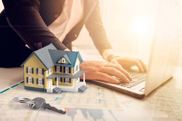 Businessmen  signing home titles with insurance, care about real estate services and the idea of...