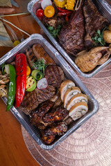 delivery of meat dishes in a foil box