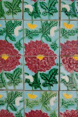 Floral ceramic tiles on walls along row of conserved pre-war terrace houses, Petain Road, Singapore