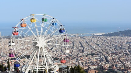 ferris wheel in the park, Barcelona  - obrazy, fototapety, plakaty