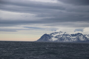 snowy mountains and sea