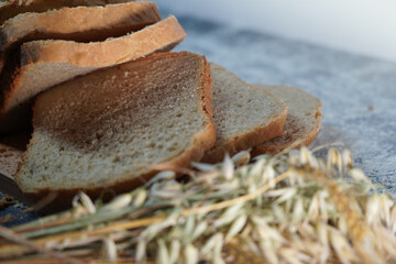 sliced homemade bread with cereals arranged on a cutting board (close-up)  