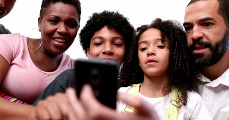 African descent family looking at cellphone together