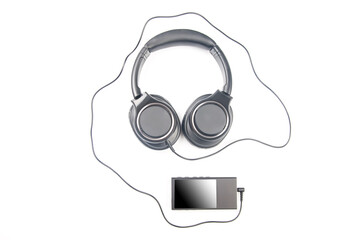Headphones for listening to music with digital audio player on white background