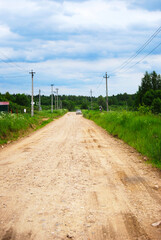 Fototapeta na wymiar Rural road, the car is driving on a rural road.