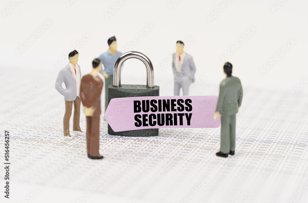 Poster There are figures of people on business reports, a padlock with a sticker on which it is written - Business security