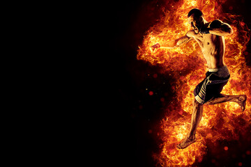 Naklejka premium Fighter man in fire. Sport advertising. MMA boxer