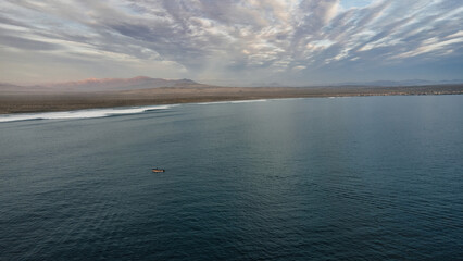Small fishing boat on the blue sea and blue sky,peaceful and lonely