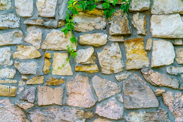 Wall of gray stones. Stone building background.