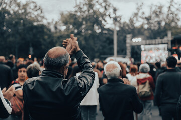 people in demonstration or a concert