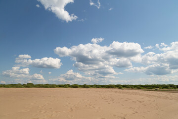 Beautiful summer landscape with clouds on the river.