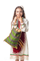 Bulgarian woman  or young girl in traditional folklore dress holds in hands golden wheat and...
