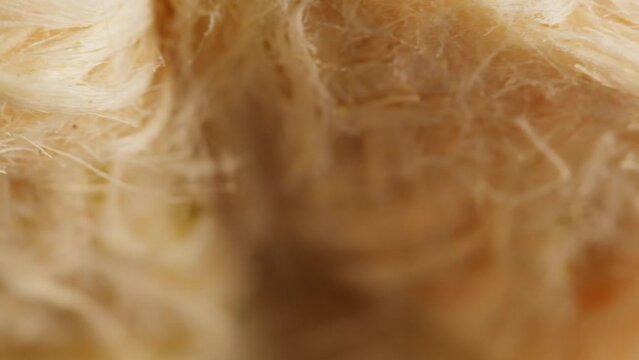 Turkish sweet food. Arabian cuisine. Pismaniye white halva close-up rotating. Middle eastern national sugar treats, dessert snack.