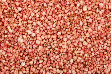 Buckwheat popcorn, close-up. Dry breakfast, air buckwheat popcorn with strawberries. Exploded grains. Design element