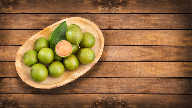 Melicoccus bijugatus fruits with their pulp and seed.