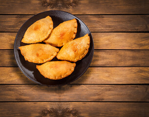 Traditional baked Argentinian empanadas savoury pastries with meat beef stuffing