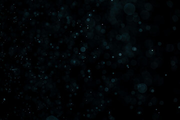 Glowing blue highlights. Wallpaper pattern. Blue sparkling spots. Dust or fog on a black background. - 516466061