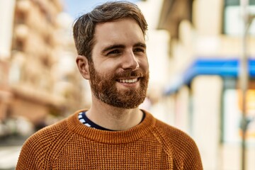 Young caucasian man with beard outdoors on a sunny day
