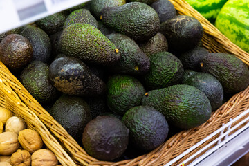 Raw avocado in box for sale in greengrocery