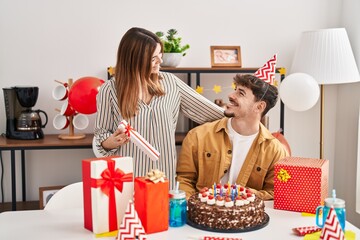 Mand and woman couple having birthday celebration at home