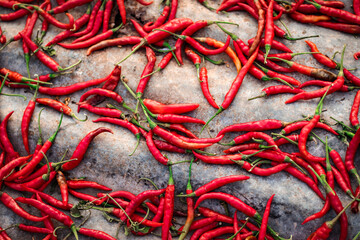 pile of hot chili peppers on roof for dry