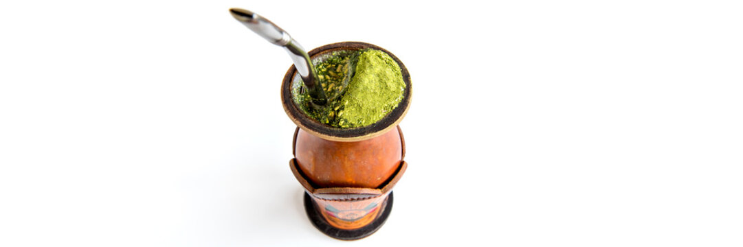 Traditional yerba mate tea, chimarr&atilde;o gaucho from southern Brazil, outdoor format white background.