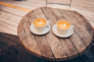 Cup of coffee on wooden background