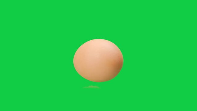 Green screen slow motion chicken egg are rolling, Egg spinning slow motion, Easter eggs background, Chroma key, Alpha channel.	