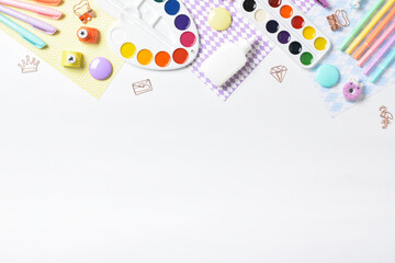 Top view of various stationery lying on a white background. Copy space. Flat lay, top view