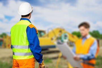 Construction engineer wear safety uniform under inspection and survey workplace, construction road background.